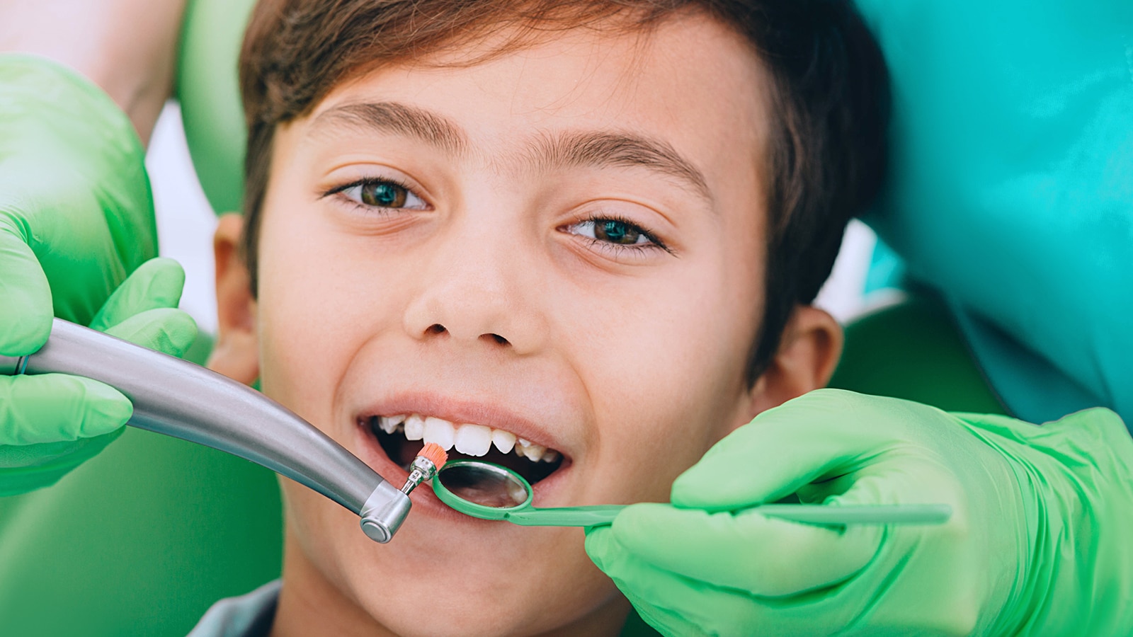 Child getting a dental cleaning Photo